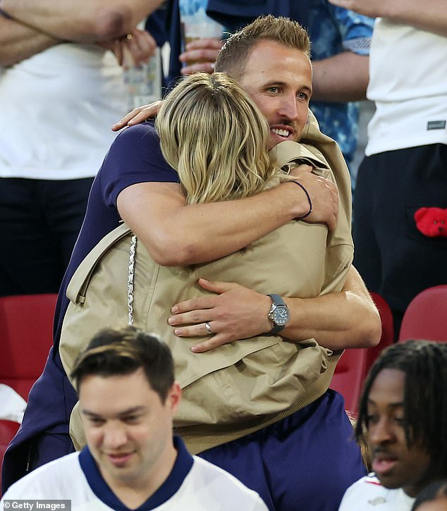 Captain Harry Kane hugged his wife Katie.