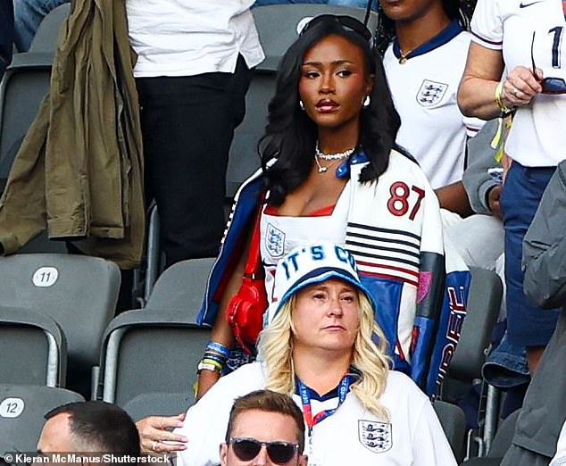 Pictured: Bukayo Saka's girlfriend Tolami Benson looked pensive as she took her seat in the stands.