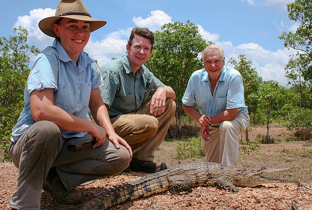 Adam Britton (centre) with his wife Erin (left) and David Attenborough (right) during the filming of a BBC documentary Cold Blood