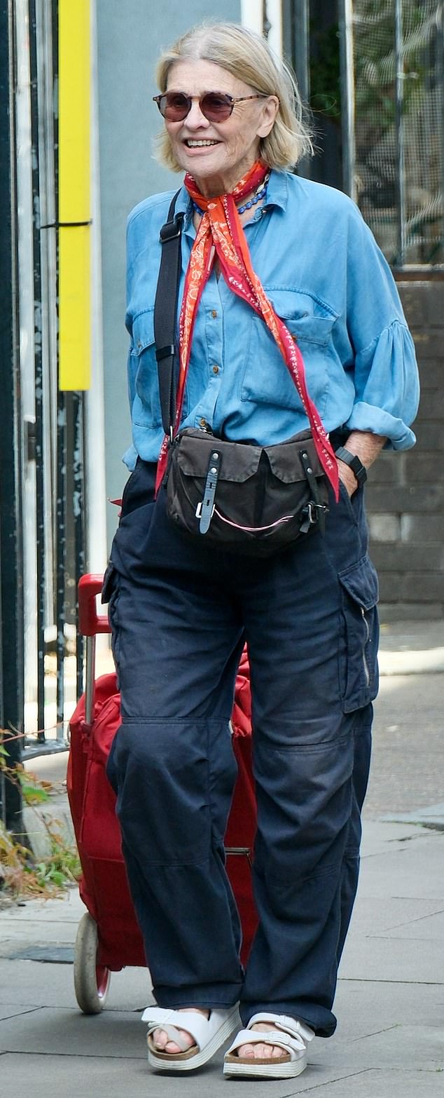 Film star Julie Christie, now 84, still cuts a stylish figure even when running errands near her home in east London. She was seen pulling a shopping trolley while wearing cargo pants, a denim shirt and white sandals.