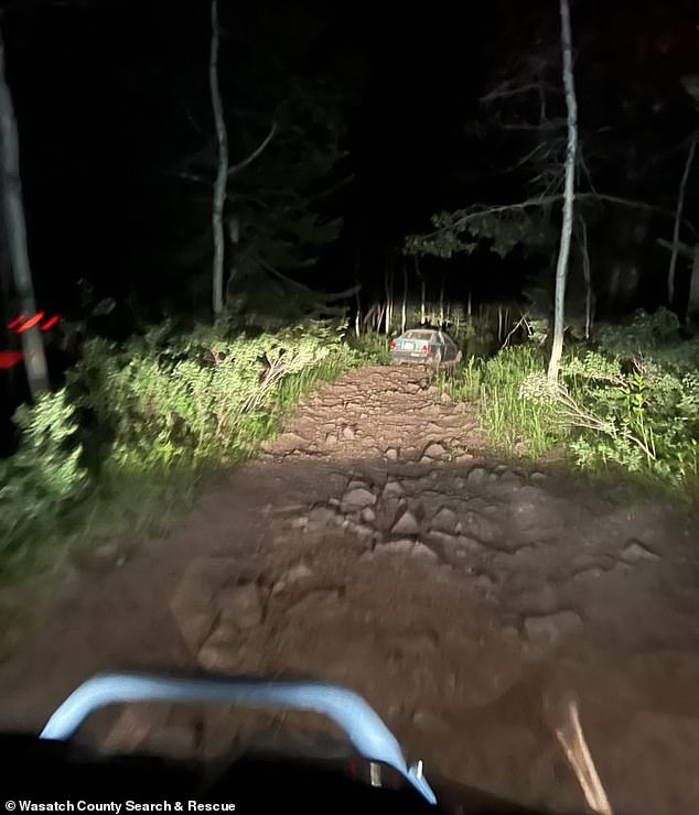 Images captured by rescue crews show the blue vehicle on a rocky dirt road, and crews had to use all-terrain vehicles just to reach the driver.