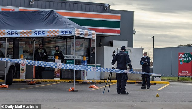 Mr Briggs was confronted by police officers in the car park of a 7-Eleven convenience store in Hoppers Crossing in the early hours of July 15. Police are pictured at the crime scene.