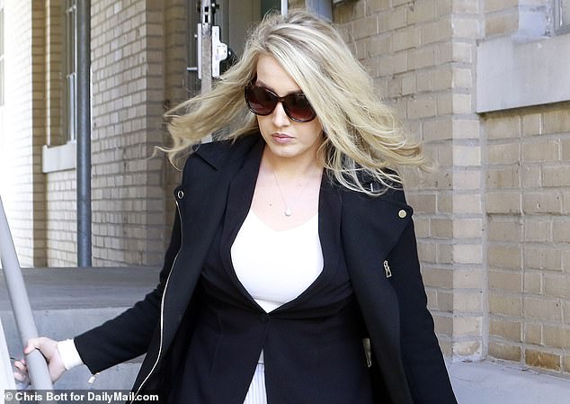 Lunden Roberts is photographed leaving court in December 2019 amid her paternity case with Hunter Biden, which she wrote about in her upcoming tell-all book. She said Hunter's team wanted her to 