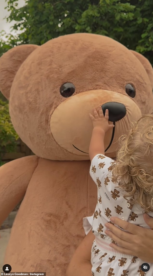 Lauryn transformed her garden into a storybook scene with a long picnic table, filled with charcuterie and a teddy bear mascot.