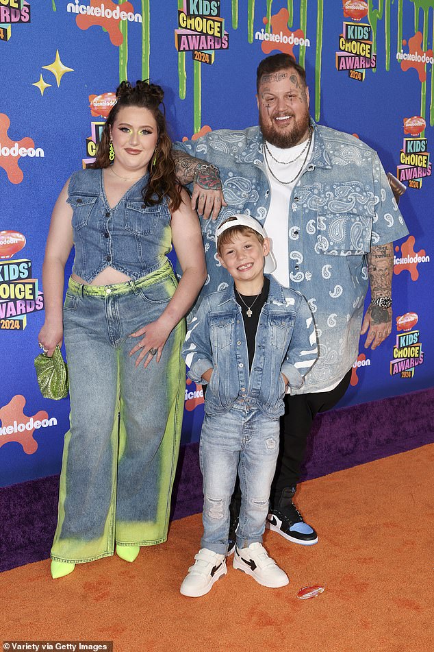 For the occasion, Jelly Roll posed in a paisley-print button-down denim shirt and black pants.