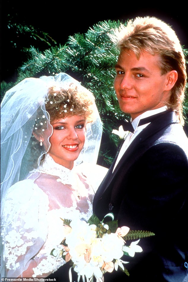 Asked if she had any memories of kissing her on-screen love interest (and real-life ex-boyfriend) Jason Donovan in his beloved Datsun car, Kylie played coy. Pictured as their characters Scott and Charlene in 1988