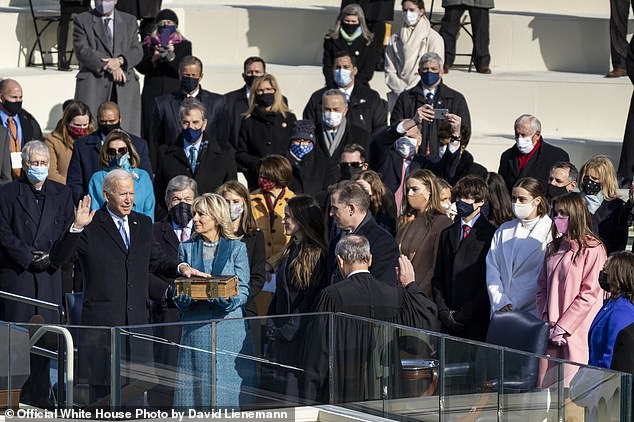 Biden, joined by Dr. Jill Biden, Ashley Biden, Hunter Biden, and his grandchildren, is sworn in as President of the United States