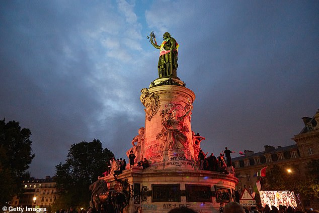 Tens of thousands of people gather at the Place de la Republique in Paris to protest against the far-right National Rally party