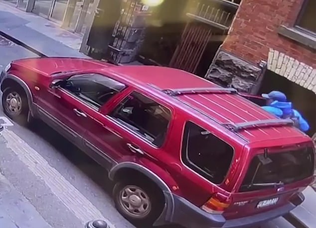 A man riding a scooter crossed the road before jumping into the driver's seat and driving away.