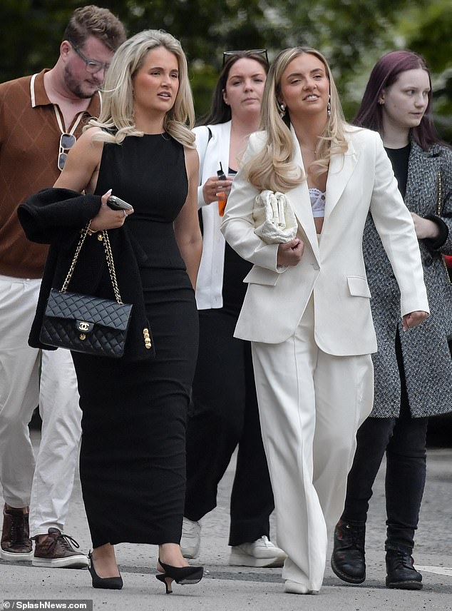 The influencer exuded elegance wearing a black dress while walking alongside her sister Zoe, who looked like the perfect bride at all times.