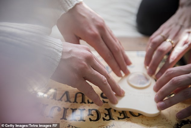 A Ouija board has letters from the Latin alphabet and numbers.