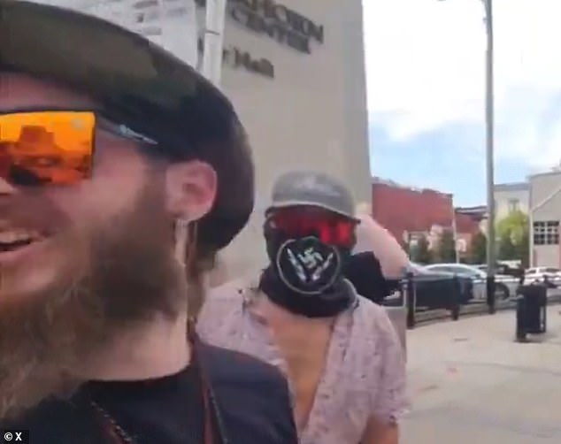 Neo Nazis filmed hurling disgusting racist slurs at black children as