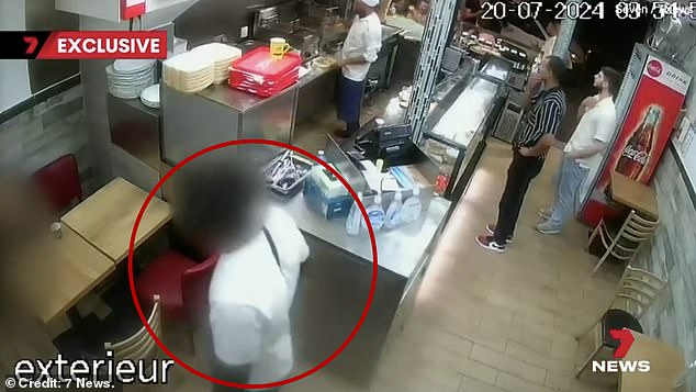 A 25-year-old woman sought refuge in a Paris kebab shop after being brutally raped by five men at around 5am. But moments later, one of the woman's alleged rapists (blurred on the far left of the image) (circled) approached her and patted her.