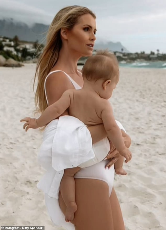 Pictured: Lady Kitty Spencer, 33, poses on a beach with her daughter Athena earlier this year.