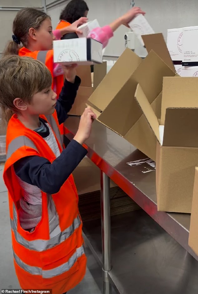 The former Miss Universe Australia winner, 36, shared a clip on Instagram on Monday capturing the youngsters hard at work packing boxes of her Kissed Earth line.