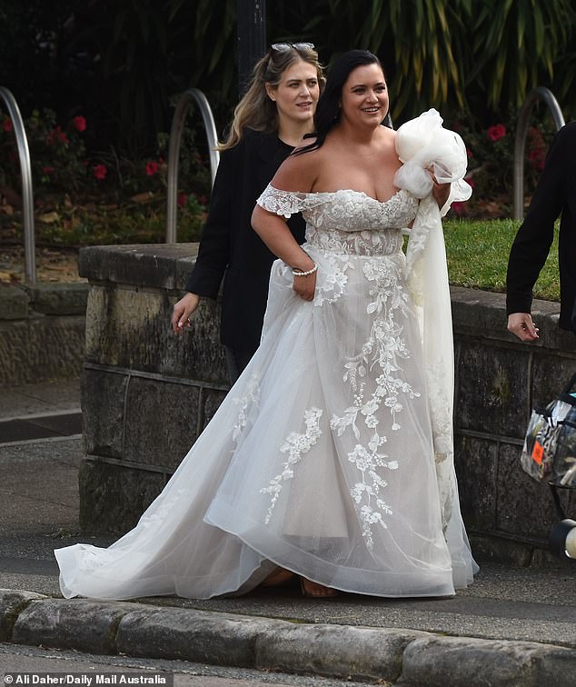 His bride, whose identity has yet to be confirmed, looked gorgeous in a stunning off-shoulder white wedding dress adorned with floral lace detailing.