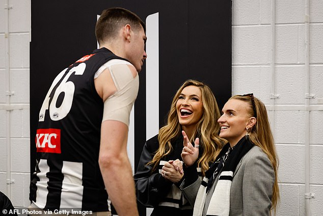 Sheltered from the Victorian cold at the Melbourne Cricket Ground (MCG), the Selling Sunset star, 43, looked dapper in black jeans and a leather jacket. Pictured with Mason Cox.