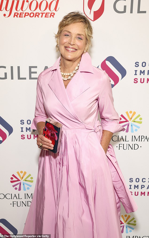 Stone, meanwhile, dazzled in a floor-length pink wrap dress.