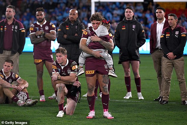 Maroons' Reece Walsh looks dejected with his teammates after NSW won the Origin decider 14-4 in Brisbane