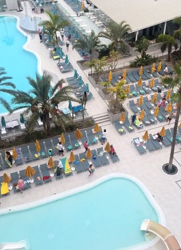 Just a minute after the pool gates opened, holidaymakers had already reserved almost all the sun loungers after competing for the best spots.