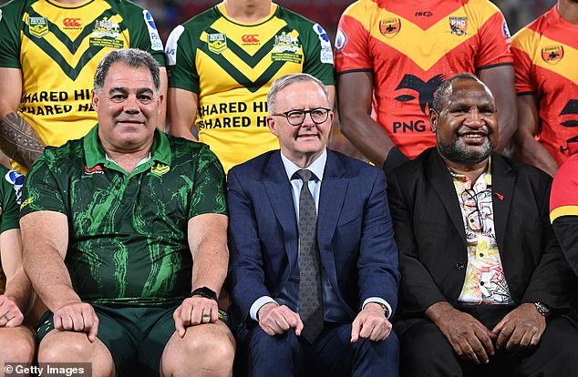 Papua New Guinea Prime Minister James Marape (right) has dismissed security concerns in his country as the Australian government prepares to donate $600 million of taxpayers' money towards the creation of an NRL team in Port Moresby. Pictured: Mal Meninga left, Anthony Albanese centre