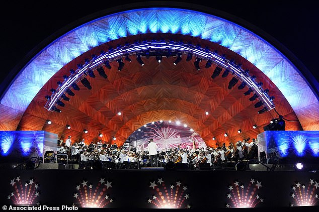 The Boston Pops Esplanade Orchestra performs during the Boston Pops fireworks show at the Hatch Memorial Shell on the Boston Esplanade.