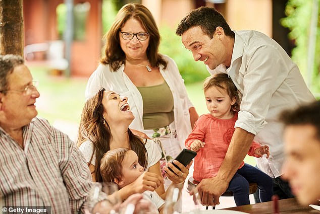 As soon as my husband picks up one of our two young children, he becomes the focus of female attention.