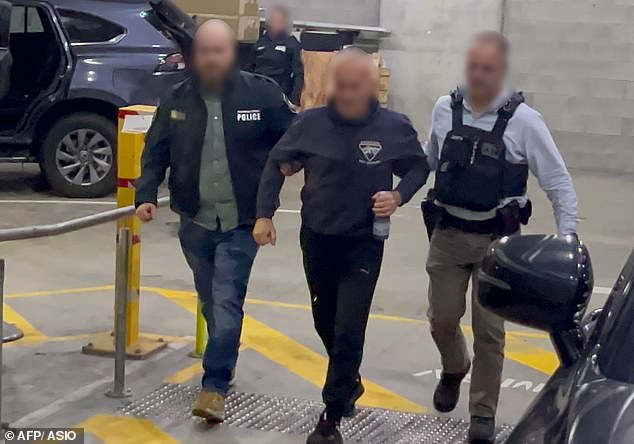 The couple are the first Australians to be charged with espionage after arriving in Australia more than a decade ago and gaining citizenship (pictured, Igor being arrested)