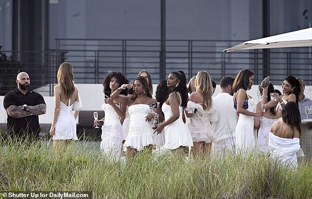 Guests are seen chatting at the sports mogul's posh property, dressed to the nines in aesthetically pleasing outfits.