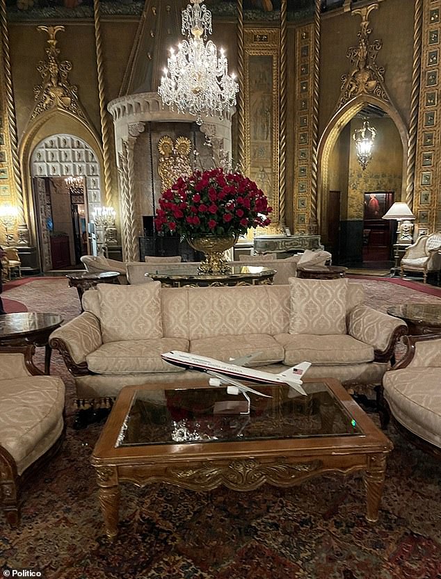 The model of Donald Trump's proposed Air Force One color scheme revision that once sat in the Oval Office is displayed on a coffee table in the lobby of Mar-A-Lago.