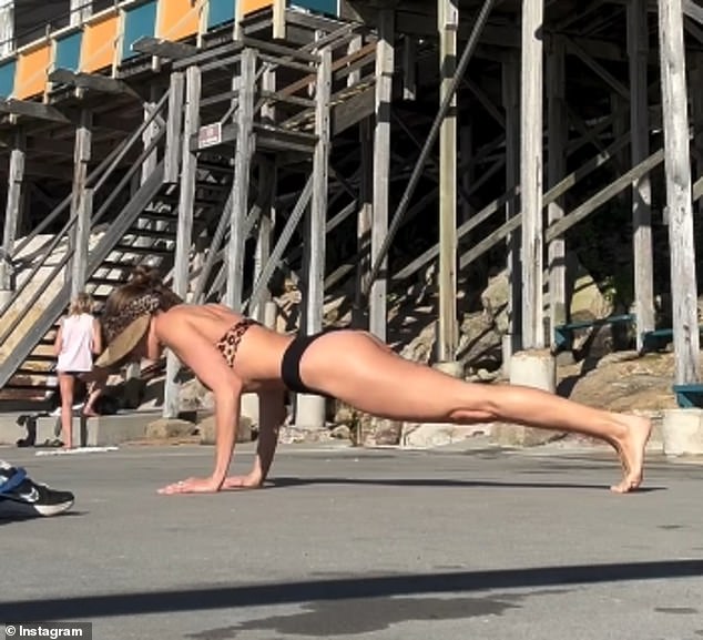 The 36-year-old Miss Universe Australia winner filmed herself doing deep squats and push-ups.