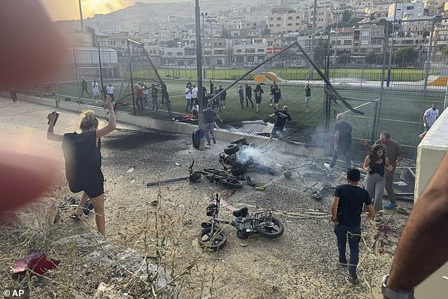 The conflict in Gaza threatens to spill over into neighbouring nations after Tel Aviv said the Lebanese armed group Hezbollah launched the deadly rocket attack that hit a football pitch.