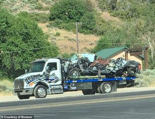 The mangled remains of the family's SUV can be seen before it was taken away.