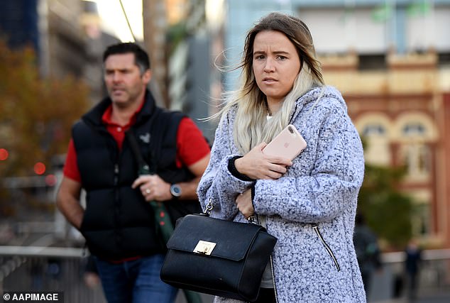 The weather system is set to bring a prolonged period of frosty nights and cold days to Victoria and southern New South Wales (pictured: pedestrian in Sydney CBD)