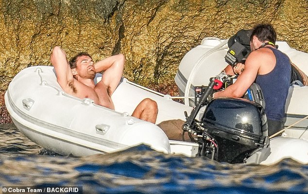 James was also seen relaxing aboard a boat with his hands behind his head and his toned torso on full display.