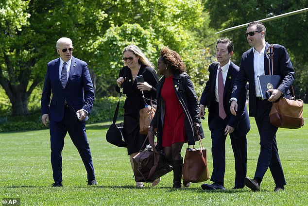 President Joe Biden, from left, walks with White House Deputy Chief of Staff Annie Tomasini, White House Press Secretary Karine Jean-Pierre, White House Deputy Chief of Staff Bruce Reed and White House Communications Director Ben LaBolt in April.