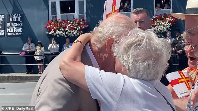 But the monarch perhaps got more than he bargained for when he greeted the public in the small town of St Peter Port in Guernsey on Tuesday. Mischievous 91-year-old Kathleen Moriarty gave the king a kiss on the cheek, much to the delight of onlookers.