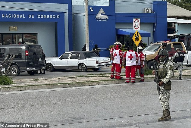 Investigators collect evidence at the scene where Almanza, president of the Tamaulipas Chamber of Commerce, was murdered in Matamoros