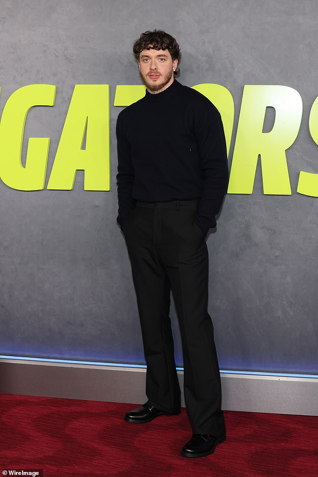 Jack Harlow, 26, who plays Scalvo in the film, cut a dapper figure on the red carpet. The rapper sported an all-black ensemble, including a turtleneck sweater.