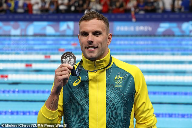 The Chinese star set a stunning world record by finishing a second ahead of Chalmers (pictured with his silver medal), but the Australian later said he is confident there was no doping involved in the incredible swim.