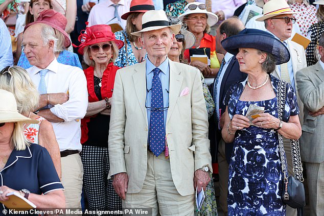 The well-heeled guests looked elegant in suits and dresses.