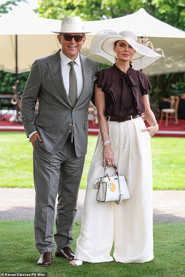 Hats off! Oversized headdresses were popular with guests