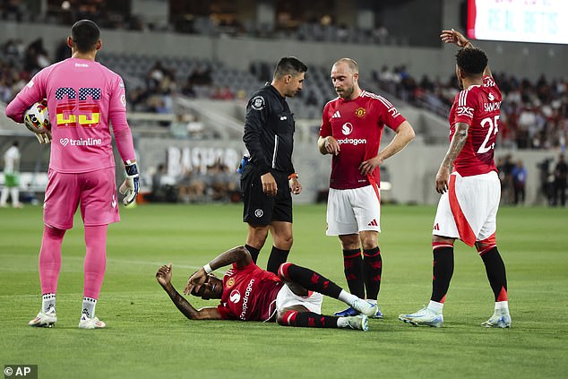 Jadon Sancho, right, called for physiotherapists to intervene after Rashford suffered the injury scare