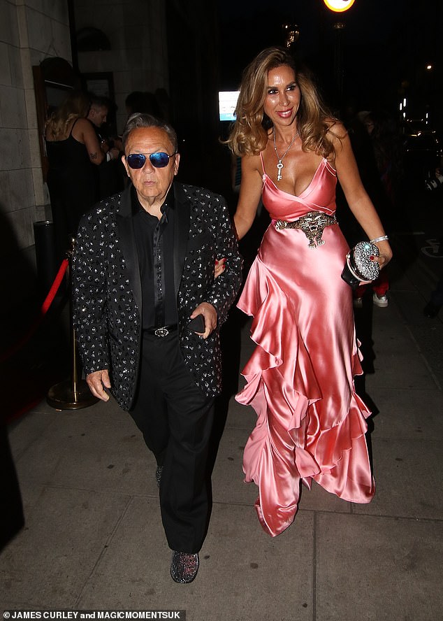 While Ampika Pickston beamed as she linked arms with billionaire fiancé David Sullivan as they left the after-party.