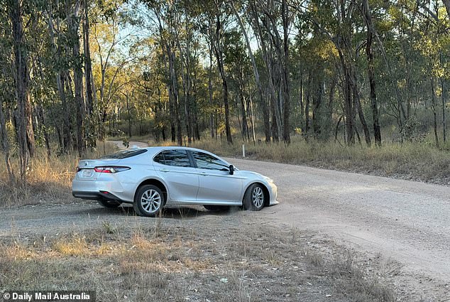 A police vehicle is seen leaving the rural property on Thursday afternoon after the case was deemed suspicious.