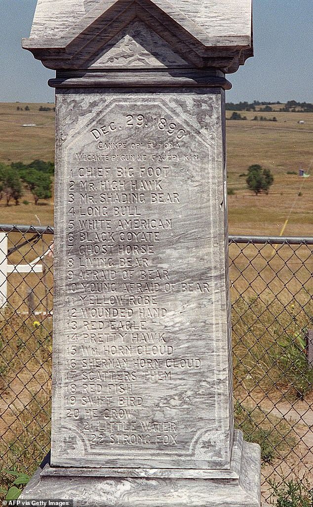 This August 2001 photograph shows a monument at the burial site of Lakota Native Americans killed in the massacre of Dec. 29, 1890.