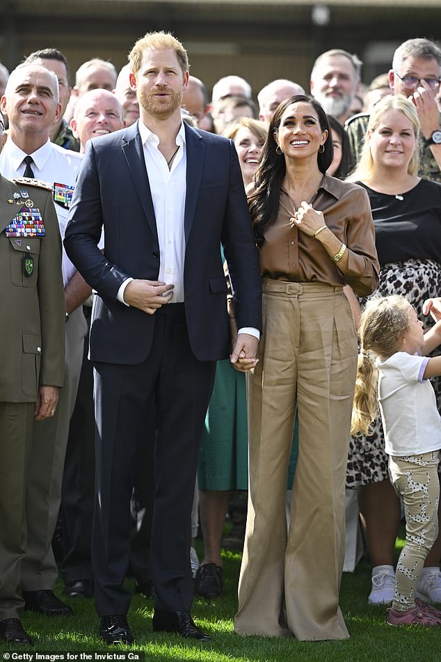 Pictured: Meghan Markle wore another pair of long trousers to the Invictus Games in Germany in September 2023.