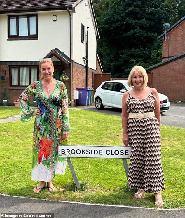 Claire looked incredible during the outing in a low-cut green printed wrap dress as she posed alongside her mother Kathleen.