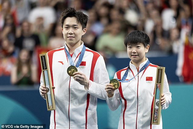 The world number 1's racket was broken by photographers while he was celebrating his gold medal