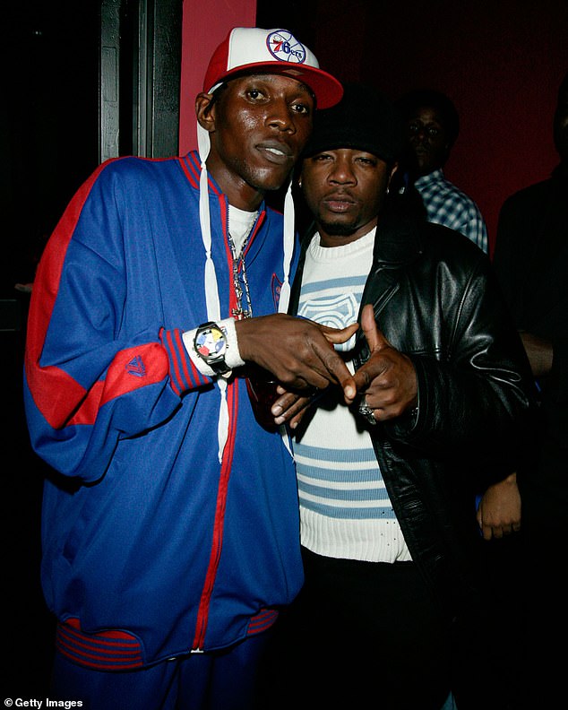 Kartel pictured with rapper Ja Rule in 2003 at a Source magazine event